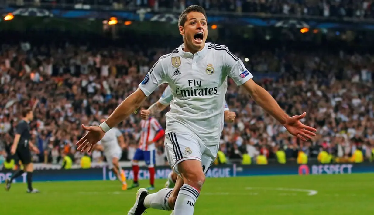 Chicharito meluapkan kegembiraan usai membobol gawang Los Rojiblancos. Bagi pemain pinjaman Manchester United tersebut, ini adalah golnya yang perdana di Liga Champions musim ini. (AP Photo/Paul White)