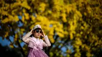 Wanita mengenakan hanbok di Korea Selatan. (ANTHONY WALLACE / AFP)