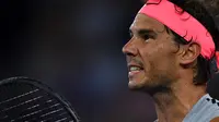 Rafael Nadal bereaksi pada perempat final Australia Terbuka 2018 melawan Marin Cilic di Rod Laver Arena, Selasa (23/1/2018). (AFP/Paul Crock)