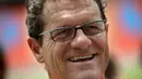 England coach Fabio Capello gestures as he coaches children during a football clinic at Rajamangala Stadium in Bangkok on July 26, 2008. Capello will hold clinics/ NICOLAS ASFOURI 