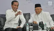 Pasangan Presiden dan Wapres terpilih, Joko Widodo atau Jokowi dan Ma'ruf Amin berbincang pada Rapat Pleno Terbuka Penetapan Presiden dan Wakil Presiden Terpilih Pemilu 2019 di Gedung KPU, Jakarta, Minggu (30/6/2019). (merdeka.com/Iqbal S Nugroho)