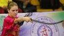 Atlet Wushu asal Ukraina, Liudmyla Temna saat beraksi, pada Kejuaraan Dunia Wushu 2015 di Istora Senayan, Jakarta, Minggu(15/11/2015). (Bola.com/Nicklas Hanoatubun)