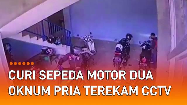 Rekaman CCTV menunjukkan dua orang pria menggunakan sebuah sepeda motor mencuri motor matic mengundang perhatian.