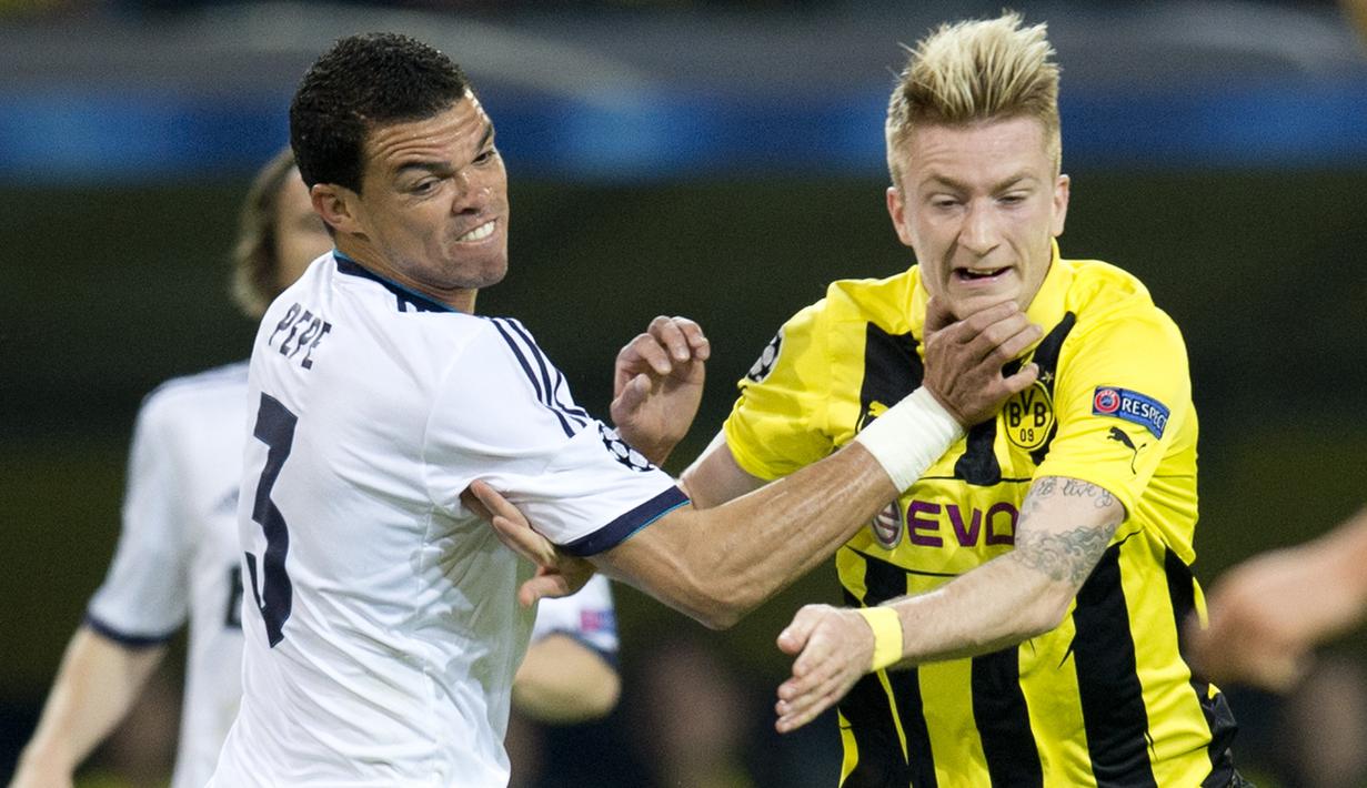 Pepe - Pemain yang pernah memperkuat Real Madrid ini memang memiliki skill yang komplit sebagai pemain bertahan. Tapi sayang Pepe seringkali bertindak kasar pada pemain lawan, dia juga pernah diskorsing 10 laga akibat menendang berkali-kali perut pemain Getafe. (AFP/Odd Andersen)