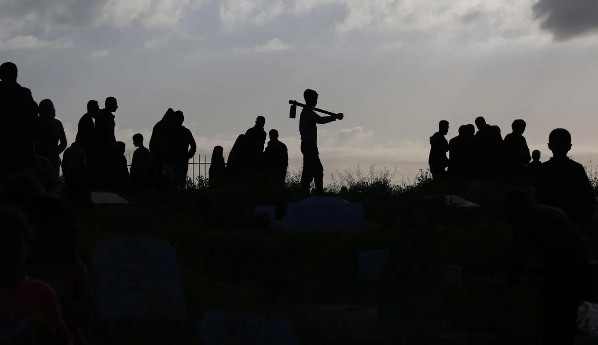 Pada hari ini, Minggu 30 Maret 2025, warga Palestina merayakan Hari Raya Idul Fitri 1446 Hijriah. (Eyad BABA/AFP)