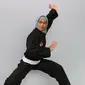 Atlet pencak silat wanita, Puspa Arumsari saat menjadi bintang tamu di Corner6, Liputan6.com di SCTV Tower, Jakarta, Rabu (18/1). (Liputan6.com/Fatkhur Rozaq)