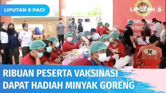 Ribuan warga mendatangi lokasi vaksinasi massal di Vihara Satya Dharma Denpasar, Bali, yang digelar oleh BIN. Usai vaksin, warga berkesempatan dapat satu liter minyak goreng.
