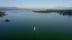 Foto dari udara yang diabadikan pada 1 September 2020 menunjukkan pemandangan Waduk Miyun di pinggiran timur laut Beijing, ibu kota China. Waduk Miyun yang memiliki kapasitas penyimpanan air sekitar 4,4 miliar meter kubik menandai 60 tahun pengoperasiannya pada Selasa (1/9). (Xinhua/Zhang Chenlin)