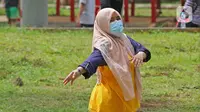Aktivitas pagi hari pasien berstatus OTG (Orang Tanpa Gejala) di RSDC Wisma Atlet, Jakarta, Selasa (26/1/2021). Data Satgas Covid-19 per Selasa (26/1) mencatat kasus COVID-19 di Indonesia bertambah 13.094 sehingga total menyentuh angka satu juta, tepatnya 1.012.350. (Liputan6.com/Herman Zakharia)