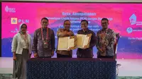 Penandatanganan MoU antara dua entitas bisnis di bawah PLN, yaitu PT Prima Layanan Nasional Enjiniring (PLN Enjiring) dengan PT Indo Raya Tenaga di Nusa Dua Bali pada Senin (14/11/2022). (Foto: Istimewa)