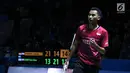 Tunggal putra Indonesia, Tommy Sugiarto merayakan poin saat melawan pebulu tangkis China Taipei, Chou Tien Chen pada 16 besar Indonesia Open 2018 di Istora GBK, Jakarta, Kamis (5/7). Tommy unggul 21-13, 14-21, 21-18. (Liputan6.com/Helmi Fithriansyah)