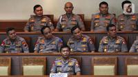 Komjen Pol Idham Azis (tengah) saat menghadiri rapat paripurna di Kompleks Parlemen, Jakarta,  Kamis (31/10/2019). Rapat paripurna DPR menyetujui Idham Aziz menjadi Kapolri menggantikan Jenderal Polisi (Purn) Tito Karnavian. (Liputan6.com/JohanTallo)