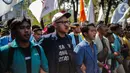 Mahasiswa yang tergabung dalam Badan Eksekutif Mahasiswa Seluruh Indonesia (BEM SI) menggelar unjuk rasa di kawasan Patung Kuda, Jakarta, Senin (21/10/2019). Salah satu tuntutannya adalah meminta Presiden Jokowi menerbitkan Perppu untuk UU KPK yang direvisi. (Liputan6.com/Faizal Fanani)