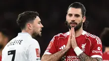 Pemain Liverpool, Dominik Szoboszlai melakukan selebrasi seusai membobol gawang Barnsley pada lanjutan Piala FA 2025/2026 di Anfield, Selasa (13/1/2026) dini hari WIB. (PETER POWELL / AFP)