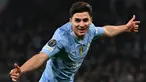 Pemain Manchester City, Julian Alvarez melakukan selebrasi setelah mencetak gol kedua timnya ke gawang FC Copenhagen pada laga leg kedua 16 besar Liga Champions 2023/2024 di Stadion Etihad, Manchester, Inggris, Kamis (07/03/2024). (AFP/Paul Ellis)