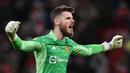 Di belakang keroposnya lini pertahanan Manchester United musim ini, ada David De Gea yang rela pontang-panting menyelamatkan gawangnya. Kiper 35 tahun yang memiliki nilai pasar sebesar 18 juta euro tersebut tercatat telah membuat 9 clean sheet dalam 34 penampilannya. (AFP/Paul Ellis)