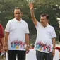 Wakil Presiden Jusuf Kalla didampingi Gubernur DKI Anies Baswedan dan Menteri PUPR, Basuki Hadi Moeljono melepas parade Asian Games 2018 di Monas, Jakarta, Minggu (13/5). Total jumlah peserta parade ini mencapai 4.800 orang. (Liputan6.com/Arya Manggala)