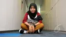 Cewek berhijab asal Purwakarta ini tak pernah menyangka akan menjadi juara di kontes musik Vidio.com, Jakarta, Kamis (29/1/2015). (Liputan6.com/Panji Diksana)