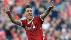 Pemain Liverpool, Roberto Firmino merayakan golnya ke gawang AFC Bournemouth pada lanjutan Premier League di Anfield stadium, Liverpool,(14/4/2018). Liverpool menang 3-0.  (AFP/Lindsey Parnaby)