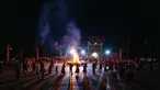 Orang-orang dari etnis minoritas Yi menari di sekitar api unggun untuk merayakan Festival Obor di Bijie, di provinsi Guizhou barat daya China pada 5 Juni 2023. (AFP/STR)
