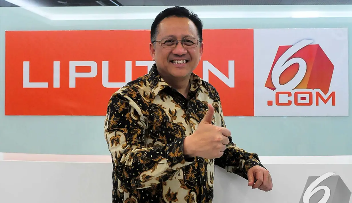 Ketua DPD Republik Indonesia Irman Gusman saat berkunjung ke Kantor Liputan6.com di SCTV Tower, Jakarta, Rabu (17/12/2014). (Liputan6.com/Johan Tallo) 