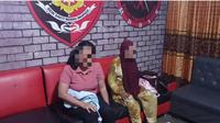 Dua pelaku pembunuhan bocah 5 tahun di Kota Gorontalo saat tiba di Polres Gorontalo Kota