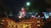 Pawai ogoh-ogoh menjelang Hari Raya Nyepi di Denpasar, Bali. (Liputan6.com/Yudha Maruta)