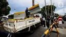 Suasana penutupan akses jalan menuju kawasan Kota Tua, Jakarta Barat, Jumat (18/12/2020). Pemerintah DKI Jakarta melarang kendaraan pribadi memasuki kawasan Kota Tua Jakarta mulai 18 hingga 23 Desember 2020 seiring penerapan kawasan rendah emisi atau Low Emission Zone. (Liputan6.com/Johan Tallo)