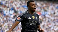 Striker Real Madrid, Kylian Mbappe, merayakan golnya ke gawang Real Sociedad pada pekan 4 Liga Spanyol 2025/2026, Sabtu (13/9/2025) malam WIB. (ANDER GILLENEA / AFP)