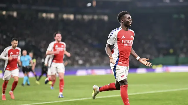 Selebrasi pemain Arsenal ketika mencukur Sporting di Liga Champions