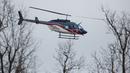 Helikopter Lifteam Air-Evac berangkat dari SMA Marshall County High School di Benton, Kentucky, Amerika Serikat, Selasa (23/1). Polisi mengamankan remaja lelaki berusia 15 tahun dalam penembakan mematikan tersebut. (Ryan Hermens / Matahari Paducah via AP)