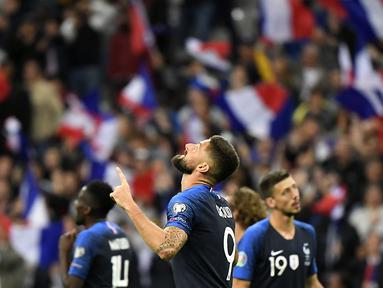 Striker Prancis, Olivier Giroud, merayakan gol yang dicetaknya ke gawang Albania pada laga Kualifikasi Piala Eropa 2020 di Stade de France, Paris, Sabtu (7/9). Prancis menang 4-1 atas Albania. (AFP/Lionel Bonaventure)