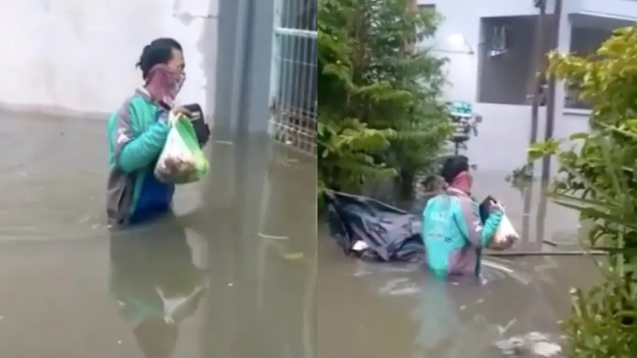 Meski Sedang Banjir Driver Ojol Ini Tetap Semangat Antar Pesanan, Bikin Salut