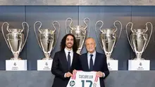 Marc Cucurella (kiri) ketika diperkenalkan sebagai pemain Real Madrid oleh Presiden El Real, Florentino Perez, di di ruang dewan Real Madrid City, Senin (24/8/2026) waktu setempat. (X/Real Madrid)