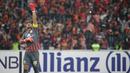 Kiper Persija Jakarta, Andritany Ardhiyasa, melakukan selebrasi saat melawan Ceres-Negros pada laga Piala AFC di SUGBK, Jakarta, Selasa (23/4). Persija takluk 2-3 dari Ceres-Negros. (Bola.com/Peksi Cahyo)