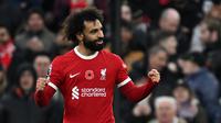 Selebrasi Mohamed Salah usai mencetak gol ke gawang Brentford dalam lanjutan Premier League 2023/2024, Minggu (12/11/2023) malam di Anfield. (AFP/Paul Ellis)