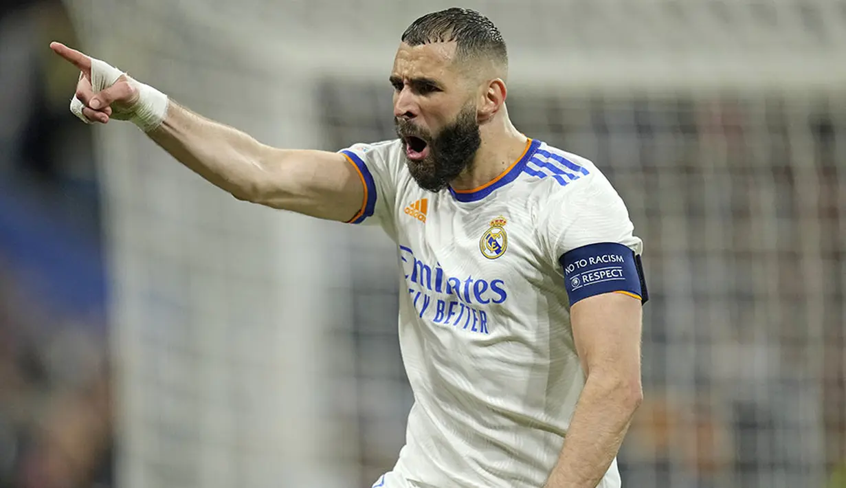 <p>Bomber Real Madrid, Karim Benzema, mantap di posisi puncak daftar top skor setelah menyumbang satu gol pada leg kedua semifinal kontra Manchester City. Total 15 gol telah ia torehkan di sepanjang Liga Champions musim ini. (AP /Manu Fernandez)</p>