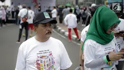 Peserta mengikuti kompetisi lari Democracy Run di Bundaran HI, Minggu (18/3). Sosialisasi pemilu ini jadi simbol penyelenggaraan pemilu yang harus berlari dan tidak ada waktu untuk berhenti sejenak. (Liputan6.com/Faizal Fanani)