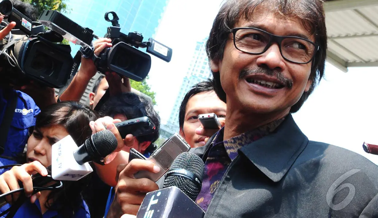   Dirjen ESDM Rida Mulya menjalani pemeriksaan di Gedung KPK, Jakarta, Jumat (12/9/2014) (Liputan6.com/Andrian M Tunay)