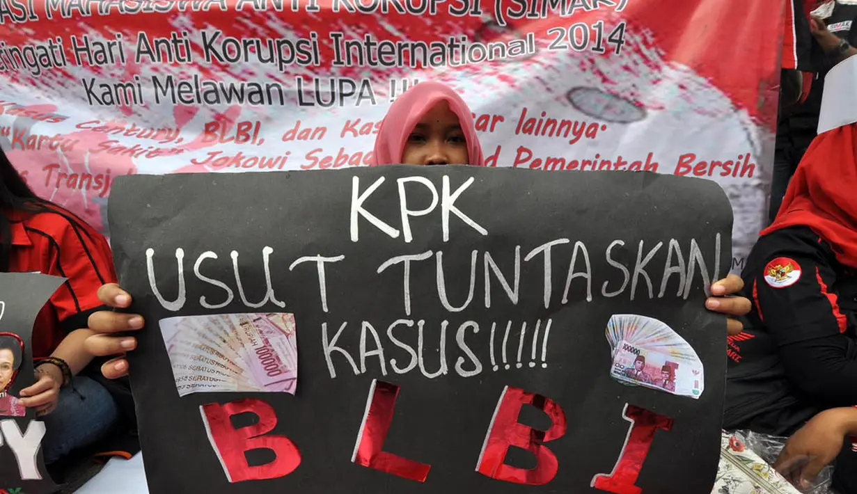 Aksi menyambut peringatan Hari Anti Korupsi Internasional (HAKI) di Bundaran HI, Jakarta, Minggu (7/12/2014). (Liputan6.com/Miftahul Hayat)