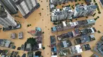 Sebuah foto udara menunjukkan bangunan-bangunan yang terendam banjir di Rongjiang, provinsi Guizhou, barat daya China pada 24 Juni 2025. (AFP/China OUT)