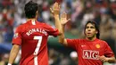 Manchester United's Cristiano Ronaldo (L) celebrates with teammate Carlos Tevez after scoring the second goal against al-Hilal during their football match at King Fahd Stadium in Riyadh, 21 January 2008. Hilal won the match 3-2. AFP PHOTO/HASSAN AMMA