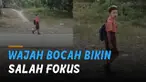 Seorang bocah laki-laki berangkat sekolah membuat salah fokus.