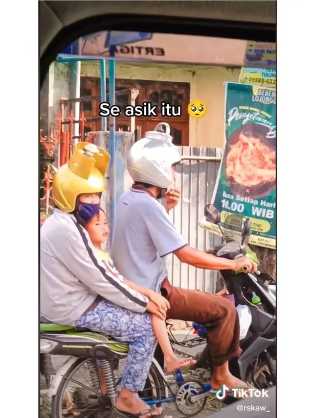 Pakai Helm Unik, Pasutri Ini Berboncengan Naik Sepeda yang Dirakit Bak Motor