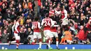 Striker Arsenal, Danny Welbeck, merayakan gol yang dicetaknya ke gawang Southampton pada laga Premier League di Stadion Emirates, London, Minggu (8/4/2018). Arsenal menang 3-2 atas Southampton. (AFP/Glyn Kirk)