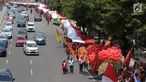 Sejumlah umat Kristiani melakukan kirab perayaan Paskah di Jalan MH Thamrin, Jakarta, Minggu (4/1). Kirab ini dimulai dari Bundaran Hotel Indonesia dan berakhir di gereja Immanuel Jakarta. (Liputan6.com/Helmi Fithriansyah)