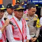 Menteri Menko PMK Muhadjir Effendy dan Menteri Perhubungan Budi Sumadi Karya saat meninjau Pos Pelayanan Terpadu Gadog, Bogor, Jumat (30/12/2022) (Liputan6.com/Achmad Sudarno)