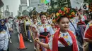 Sejumlah penari dari Yayasan Belantara Budaya Indonesia menampilkan tarian tradisional saat Parade Budaya dalam pelaksanaan Car Free Day di kawasan Bundaran HI, Jakarta, Minggu (10/9/2023). (Liputan6.com/Faizal Fanani)