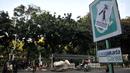 Poster tuntutan buruh terlihat di Jalan Merdeka Barat, Jakarta, Selasa (1/5). Aksi May Day di Jakarta meninggalkan jejak vandalisme yang dibuat kaum pekerja itu. (Merdeka.com/ Iqbal S. Nugroho)