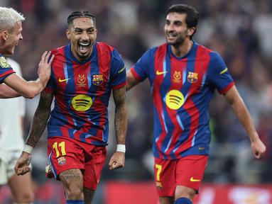 Kemenangan Barcelona atas Real Madrid dalam partai final Piala Super Spanyol 2026 tak lepas dari penampilan gemilang Raphinha. (AFP/Haitham Al-Shukairi)